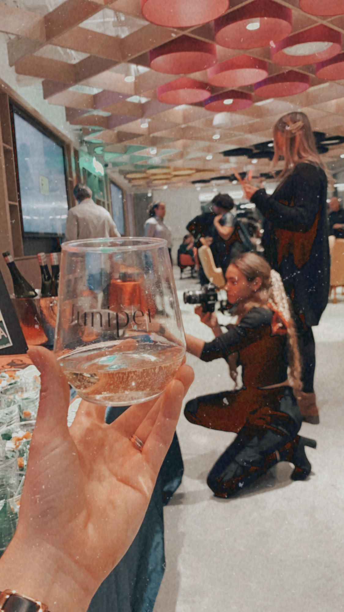 Cassandra taking photos at event